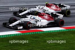 Marcus Ericsson (SWE) Sauber C37 and team mate Charles Leclerc (MON) Sauber F1 Team C37. 29.06.2018. Formula 1 World Championship, Rd 9, Austrian Grand Prix, Spielberg, Austria, Practice Day.
