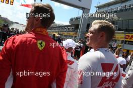 Sebastian Vettel (GER) Ferrari SF71H and Kevin Magnussen (DEN) Haas VF-18. 01.07.2018. Formula 1 World Championship, Rd 9, Austrian Grand Prix, Spielberg, Austria, Race Day.