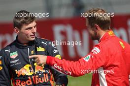 Max Verstappen (NLD) Red Bull Racing and Sebastian Vettel (GER) Scuderia Ferrari  01.07.2018. Formula 1 World Championship, Rd 9, Austrian Grand Prix, Spielberg, Austria, Race Day.