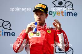 3rd place Sebastian Vettel (GER) Ferrari SF71H with a can of Red Bull. 01.07.2018. Formula 1 World Championship, Rd 9, Austrian Grand Prix, Spielberg, Austria, Race Day.