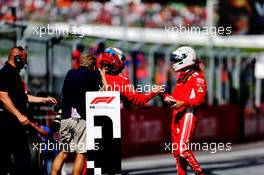 (L to R): second placed Kimi Raikkonen (FIN) Ferrari celebrates with third placed team mate Sebastian Vettel (GER) Ferrari in parc ferme. 01.07.2018. Formula 1 World Championship, Rd 9, Austrian Grand Prix, Spielberg, Austria, Race Day.
