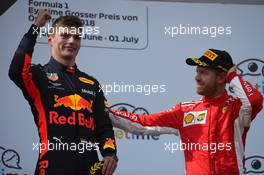 1st place Max Verstappen (NLD) Red Bull Racing RB14 and 3rd place Sebastian Vettel (GER) Ferrari SF71H. 01.07.2018. Formula 1 World Championship, Rd 9, Austrian Grand Prix, Spielberg, Austria, Race Day.