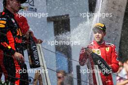 Sebastian Vettel (GER) Ferrari celebrates his third position on the podium with race winner Max Verstappen (NLD) Red Bull Racing. 01.07.2018. Formula 1 World Championship, Rd 9, Austrian Grand Prix, Spielberg, Austria, Race Day.