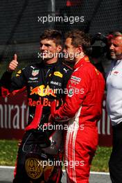 (L to R): race winner Max Verstappen (NLD) Red Bull Racing with Sebastian Vettel (GER) Ferrari in parc ferme. 01.07.2018. Formula 1 World Championship, Rd 9, Austrian Grand Prix, Spielberg, Austria, Race Day.