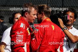 (L to R): Kimi Raikkonen (FIN) Ferrari with team mate Sebastian Vettel (GER) Ferrari in parc ferme. 01.07.2018. Formula 1 World Championship, Rd 9, Austrian Grand Prix, Spielberg, Austria, Race Day.
