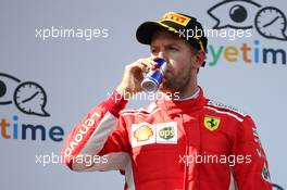 3rd place Sebastian Vettel (GER) Ferrari SF71H with a can of Red Bull. 01.07.2018. Formula 1 World Championship, Rd 9, Austrian Grand Prix, Spielberg, Austria, Race Day.