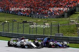 Charles Leclerc (MON) Sauber F1 Team C37 and Pierre Gasly (FRA) Scuderia Toro Rosso STR13 battle for position. 01.07.2018. Formula 1 World Championship, Rd 9, Austrian Grand Prix, Spielberg, Austria, Race Day.