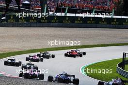 Valtteri Bottas (FIN) Mercedes AMG F1 W09 passes Kimi Raikkonen (FIN) Ferrari SF71H at the start of the race. 01.07.2018. Formula 1 World Championship, Rd 9, Austrian Grand Prix, Spielberg, Austria, Race Day.