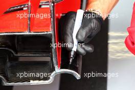 Ferrari SF71H front wing and a mechanic with a pen.