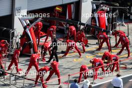 Ferrari mechanics perform warm up stretches. 30.06.2018. Formula 1 World Championship, Rd 9, Austrian Grand Prix, Spielberg, Austria, Qualifying Day.