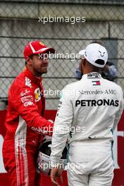 (L to R): Sebastian Vettel (GER) Ferrari with Lewis Hamilton (GBR) Mercedes AMG F1 in qualifying parc ferme. 30.06.2018. Formula 1 World Championship, Rd 9, Austrian Grand Prix, Spielberg, Austria, Qualifying Day.