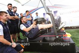 Williams team mechanics play on the paddock simulator. 30.06.2018. Formula 1 World Championship, Rd 9, Austrian Grand Prix, Spielberg, Austria, Qualifying Day.