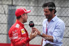 Sebastian Vettel (GER) Ferrari with Mark Webber (AUS) Channel 4 Presenter in qualifying parc ferme. 30.06.2018. Formula 1 World Championship, Rd 9, Austrian Grand Prix, Spielberg, Austria, Qualifying Day.