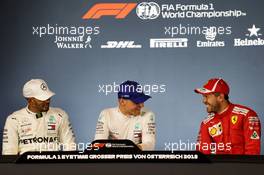 The post qualifying FIA Press Conference (L to R): Lewis Hamilton (GBR) Mercedes AMG F1, second; Valtteri Bottas (FIN) Mercedes AMG F1, pole position; Sebastian Vettel (GER) Ferrari, third. 30.06.2018. Formula 1 World Championship, Rd 9, Austrian Grand Prix, Spielberg, Austria, Qualifying Day.