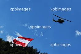 Austrian flag carried by a helicopter. 01.07.2018. Formula 1 World Championship, Rd 9, Austrian Grand Prix, Spielberg, Austria, Race Day.