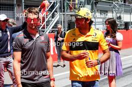 (L to R): Romain Grosjean (FRA) Haas F1 Team with Carlos Sainz Jr (ESP) Renault Sport F1 Team on the drivers parade. 01.07.2018. Formula 1 World Championship, Rd 9, Austrian Grand Prix, Spielberg, Austria, Race Day.
