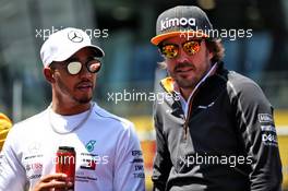(L to R): Lewis Hamilton (GBR) Mercedes AMG F1 with Fernando Alonso (ESP) McLaren on the drivers parade. 01.07.2018. Formula 1 World Championship, Rd 9, Austrian Grand Prix, Spielberg, Austria, Race Day.