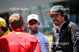 (L to R): Lewis Hamilton (GBR) Mercedes AMG F1 with Fernando Alonso (ESP) McLaren on the drivers parade. 01.07.2018. Formula 1 World Championship, Rd 9, Austrian Grand Prix, Spielberg, Austria, Race Day.