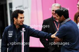 Sergio Perez (MEX) Sahara Force India F1 with Karun Chandhok (IND) Channel 4 Technical Analyst. 28.06.2018. Formula 1 World Championship, Rd 9, Austrian Grand Prix, Spielberg, Austria, Preparation Day.