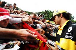 Carlos Sainz Jr (ESP) Renault Sport F1 Team signs autographs for the fans. 28.06.2018. Formula 1 World Championship, Rd 9, Austrian Grand Prix, Spielberg, Austria, Preparation Day.