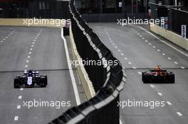 Brendon Hartley (NZL) Scuderia Toro Rosso STR13 and Daniel Ricciardo (AUS) Red Bull Racing RB14. 27.04.2018. Formula 1 World Championship, Rd 4, Azerbaijan Grand Prix, Baku Street Circuit, Azerbaijan, Practice Day.