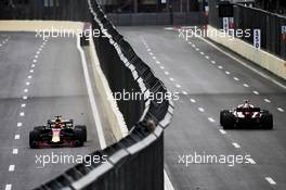 Daniel Ricciardo (AUS) Red Bull Racing RB14 and Marcus Ericsson (SWE) Sauber C37. 27.04.2018. Formula 1 World Championship, Rd 4, Azerbaijan Grand Prix, Baku Street Circuit, Azerbaijan, Practice Day.