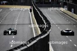 Valtteri Bottas (FIN) Mercedes AMG F1 W09 and Sergey Sirotkin (RUS) Williams FW41. 27.04.2018. Formula 1 World Championship, Rd 4, Azerbaijan Grand Prix, Baku Street Circuit, Azerbaijan, Practice Day.