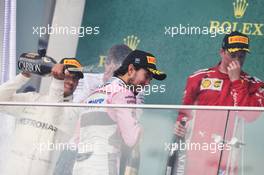 (L to R): race winner celebrates with the champagne with third placed Sergio Perez (MEX) Sahara Force India F1 and second placed Kimi Raikkonen (FIN) Ferrari. 29.04.2018. Formula 1 World Championship, Rd 4, Azerbaijan Grand Prix, Baku Street Circuit, Azerbaijan, Race Day.