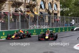 (L to R): Daniel Ricciardo (AUS) Red Bull Racing RB14 and Max Verstappen (NLD) Red Bull Racing RB14 battle for position. 29.04.2018. Formula 1 World Championship, Rd 4, Azerbaijan Grand Prix, Baku Street Circuit, Azerbaijan, Race Day.