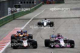 (L to R): Kevin Magnussen (DEN) Haas VF-18 and Sergio Perez (MEX) Sahara Force India F1 VJM11 battle for position. 29.04.2018. Formula 1 World Championship, Rd 4, Azerbaijan Grand Prix, Baku Street Circuit, Azerbaijan, Race Day.