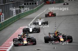 (L to R): Daniel Ricciardo (AUS) Red Bull Racing RB14 and team mate Max Verstappen (NLD) Red Bull Racing RB14 battle for position. 29.04.2018. Formula 1 World Championship, Rd 4, Azerbaijan Grand Prix, Baku Street Circuit, Azerbaijan, Race Day.
