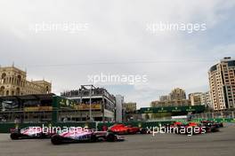 Esteban Ocon (FRA) Sahara Force India F1 VJM11 and Sergio Perez (MEX) Sahara Force India F1 VJM11 at the start of the race. 29.04.2018. Formula 1 World Championship, Rd 4, Azerbaijan Grand Prix, Baku Street Circuit, Azerbaijan, Race Day.