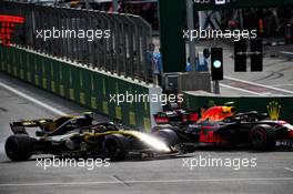 (L to R): Carlos Sainz Jr (ESP) Renault Sport F1 Team RS18 and Max Verstappen (NLD) Red Bull Racing RB14 battle for position. 29.04.2018. Formula 1 World Championship, Rd 4, Azerbaijan Grand Prix, Baku Street Circuit, Azerbaijan, Race Day.