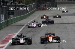 (L to R): Romain Grosjean (FRA) Haas F1 Team VF-18 and Stoffel Vandoorne (BEL) McLaren MCL33 battle for position. 29.04.2018. Formula 1 World Championship, Rd 4, Azerbaijan Grand Prix, Baku Street Circuit, Azerbaijan, Race Day.