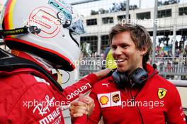 Sebastian Vettel (GER) Ferrari celebrates his pole position with Antti Kontsas (FIN) Personal Trainer. 28.04.2018. Formula 1 World Championship, Rd 4, Azerbaijan Grand Prix, Baku Street Circuit, Azerbaijan, Qualifying Day.