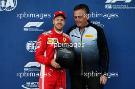Sebastian Vettel (GER) Ferrari with his Pirelli Pole Position Award, presented by Mario Isola (ITA) Pirelli Racing Manager. 28.04.2018. Formula 1 World Championship, Rd 4, Azerbaijan Grand Prix, Baku Street Circuit, Azerbaijan, Qualifying Day.