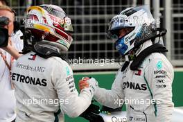 (L to R): Lewis Hamilton (GBR) Mercedes AMG F1 celebrates with team mate Valtteri Bottas (FIN) Mercedes AMG F1 in qualifying parc ferme. 28.04.2018. Formula 1 World Championship, Rd 4, Azerbaijan Grand Prix, Baku Street Circuit, Azerbaijan, Qualifying Day.