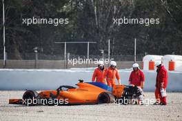 Fernando Alonso (ESP) McLaren MCL33 in the gravel trap with a wheel missing. 26.02.2018. Formula One Testing, Day One, Barcelona, Spain. Monday.