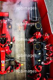 The Ferrari SF71H of Sebastian Vettel (GER) Ferrari smokes in the pits. 08.03.2018. Formula One Testing, Day Three, Barcelona, Spain. Thursday.
