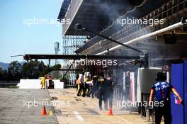 Smoke coming from the Haas F1 Team garage. 15.05.2018. Formula One In Season Testing, Day One, Barcelona, Spain. Tuesday.