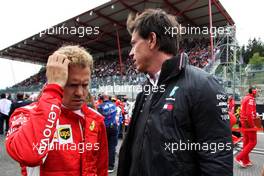 Sebastian Vettel (GER) Ferrari with Toto Wolff (GER) Mercedes AMG F1 Shareholder and Executive Director on the grid. 26.08.2018. Formula 1 World Championship, Rd 13, Belgian Grand Prix, Spa Francorchamps, Belgium, Race Day.