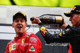 (L to R): race winner Sebastian Vettel (GER) Ferrari celebrates on the podium with third placed Max Verstappen (NLD) Red Bull Racing. 26.08.2018. Formula 1 World Championship, Rd 13, Belgian Grand Prix, Spa Francorchamps, Belgium, Race Day.