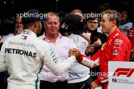(L to R): second placed Lewis Hamilton (GBR) Mercedes AMG F1 congratulates race winner Sebastian Vettel (GER) Ferrari in parc ferme. 26.08.2018. Formula 1 World Championship, Rd 13, Belgian Grand Prix, Spa Francorchamps, Belgium, Race Day.