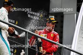 (L to R): Lewis Hamilton (GBR) Mercedes AMG F1 and race winner Sebastian Vettel (GER) Ferrari celebrate on the podium. 26.08.2018. Formula 1 World Championship, Rd 13, Belgian Grand Prix, Spa Francorchamps, Belgium, Race Day.