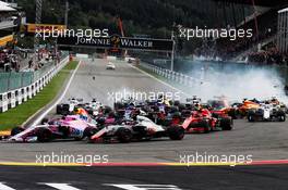 Sergio Perez (MEX) Racing Point Force India F1 VJM11 and Romain Grosjean (FRA) Haas F1 Team VF-18 at the start of the race. 26.08.2018. Formula 1 World Championship, Rd 13, Belgian Grand Prix, Spa Francorchamps, Belgium, Race Day.