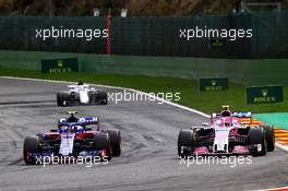 (L to R): Pierre Gasly (FRA) Scuderia Toro Rosso STR13 and Esteban Ocon (FRA) Racing Point Force India F1 VJM11 battle for position. 26.08.2018. Formula 1 World Championship, Rd 13, Belgian Grand Prix, Spa Francorchamps, Belgium, Race Day.