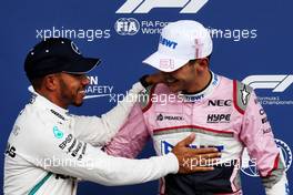 (L to R): Lewis Hamilton (GBR) Mercedes AMG F1 celebrates his pole position with third placed Esteban Ocon (FRA) Racing Point Force India F1 Team in qualifying parc ferme. 25.08.2018. Formula 1 World Championship, Rd 13, Belgian Grand Prix, Spa Francorchamps, Belgium, Qualifying Day.
