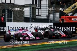 Sergio Perez (MEX) Racing Point Force India F1 VJM11 and Romain Grosjean (FRA) Haas F1 Team VF-18. 25.08.2018. Formula 1 World Championship, Rd 13, Belgian Grand Prix, Spa Francorchamps, Belgium, Qualifying Day.