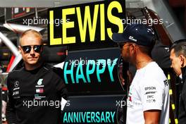 Valtteri Bottas (FIN) Mercedes AMG F1 and Lewis Hamilton (GBR) Mercedes AMG F1 celebrate the Mercedes AMG F1 team's anniversary with Petronas. 26.08.2018. Formula 1 World Championship, Rd 13, Belgian Grand Prix, Spa Francorchamps, Belgium, Race Day.