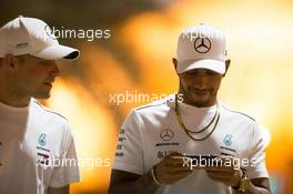 (L to R): Valtteri Bottas (FIN) Mercedes AMG F1 with team mate Lewis Hamilton (GBR) Mercedes AMG F1. 06.04.2018. Formula 1 World Championship, Rd 2, Bahrain Grand Prix, Sakhir, Bahrain, Practice Day